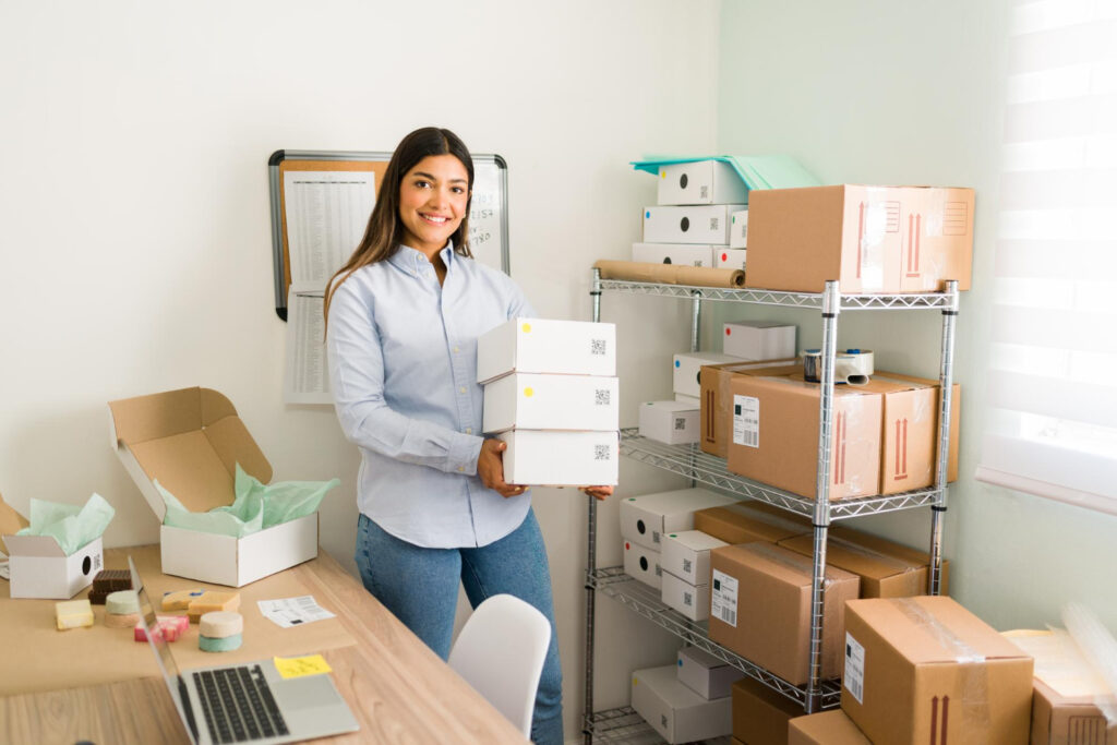 Amazon low inventory fee - Woman holding boxes, symbolizing the importance of inventory management