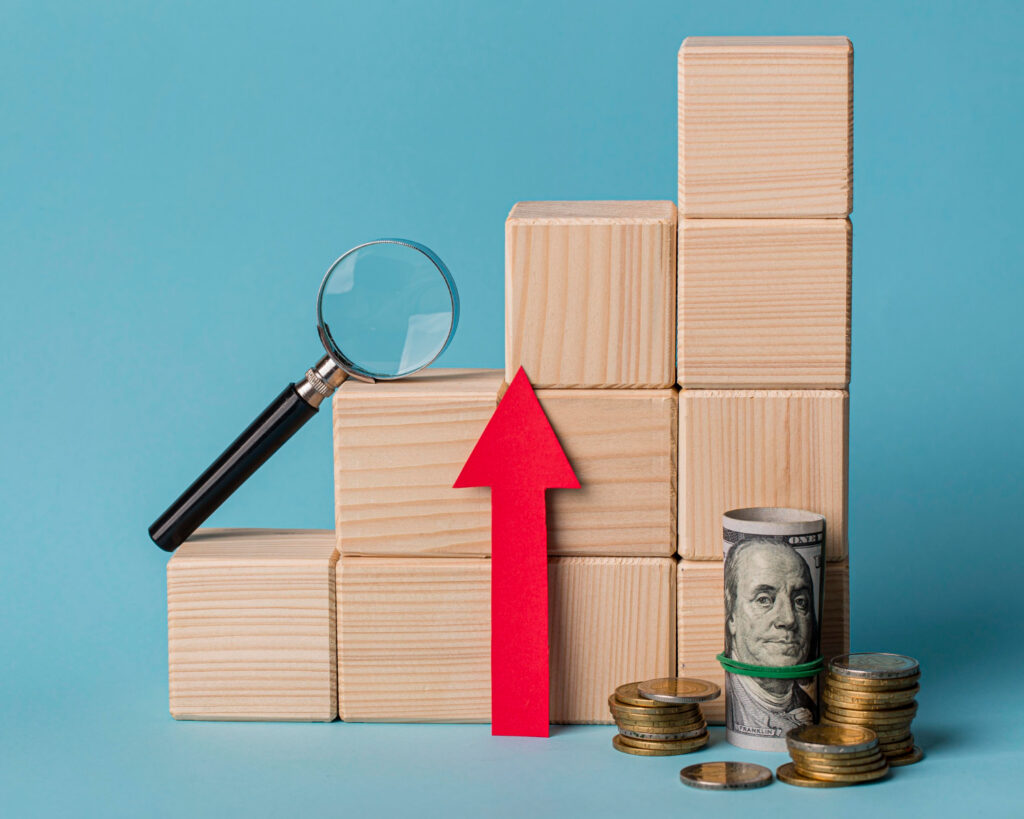 Amazon repricing software - Blocks, upward arrow, money, and magnifying glass symbolize profit growth