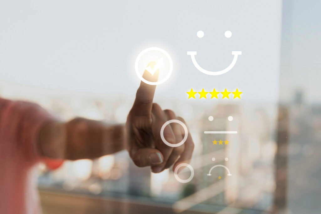 How to get reviews on Amazon - Hand interacting with a review system and star ratings