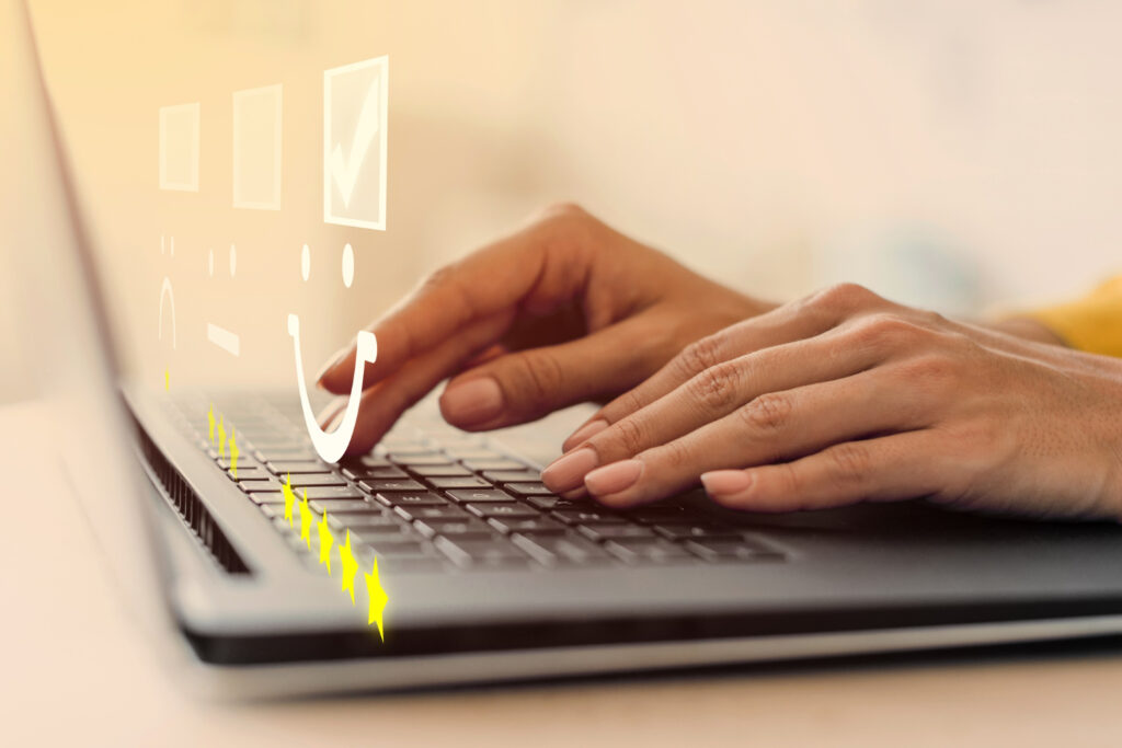 Amazon Vine - Hands typing on a laptop with a digital review interface