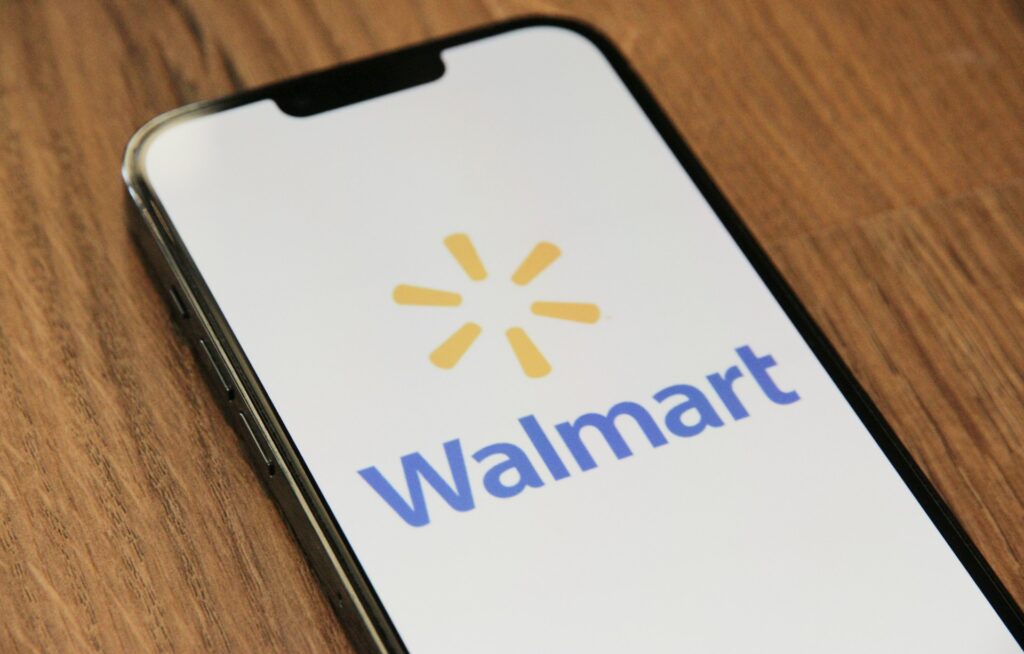 How to get approval to sell on walmart.com - A smartphone displaying the Walmart logo