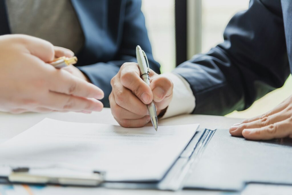 Amazon seller insurance - An FBA business owner or seller signing a contract for insurance coverage