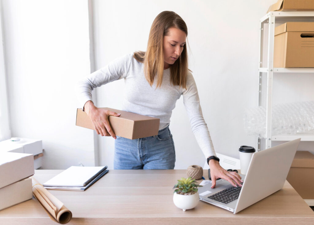 Best eBay listing software - A seller using software on her laptop to manage listings