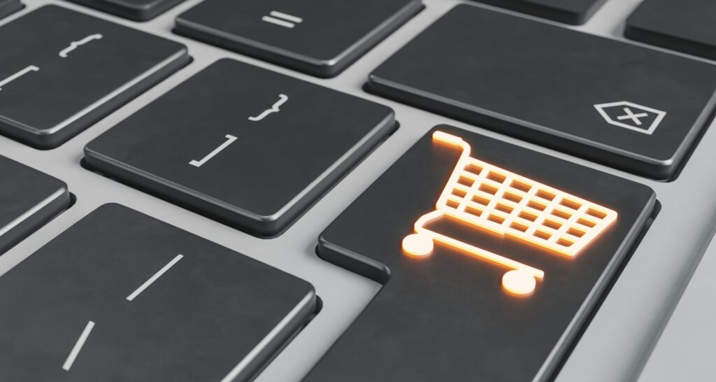 Top online shopping websites - A keyboard key with a glowing shopping cart icon