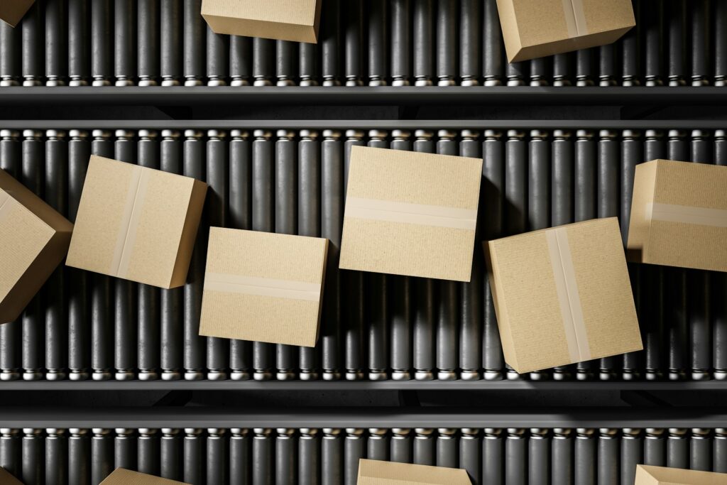 Amazon FBA dropshipping - Packages on a conveyor belt showing automated fulfillment