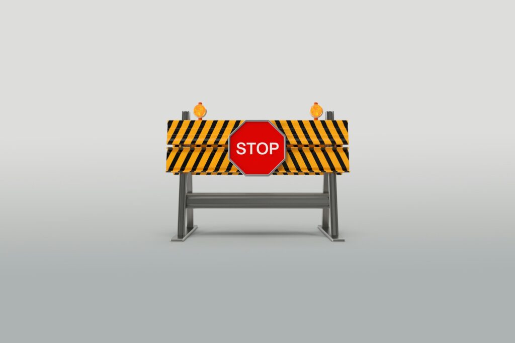 Approval restricted Amazon categories - A red stop sign on a barrier, symbolizing restrictions