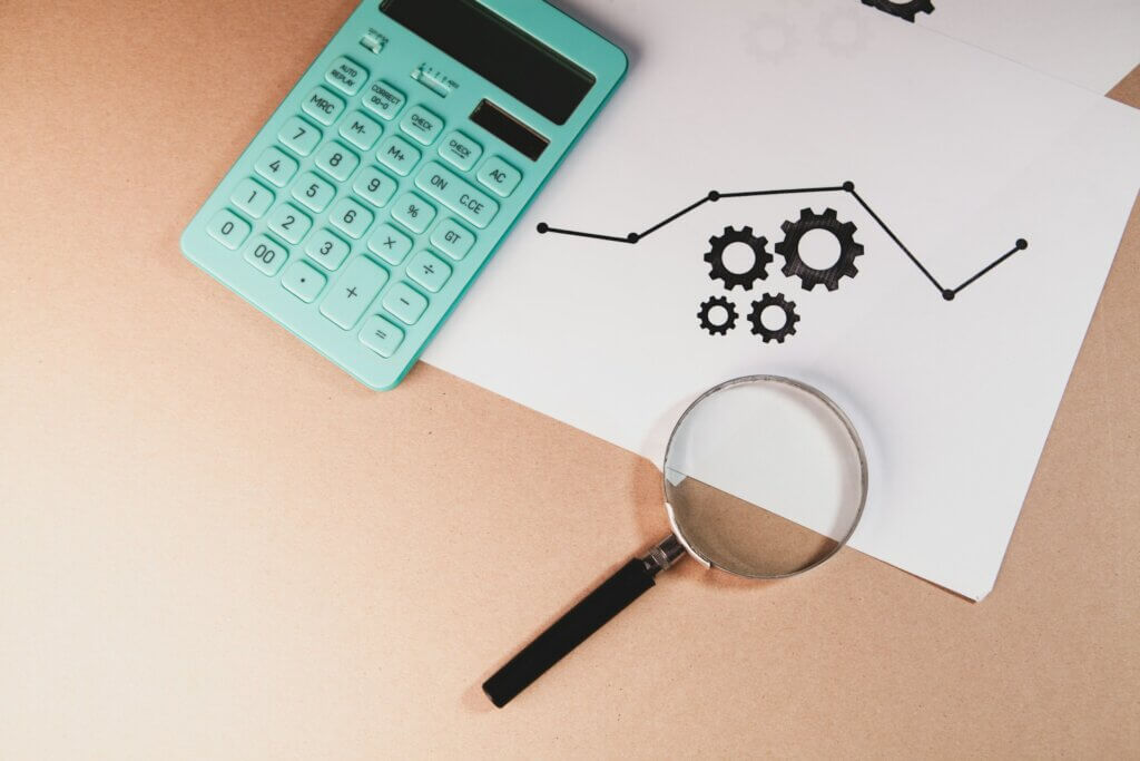 Amazon keyword research tools - A magnifying glass, calculator, and a line chart with gear icons.