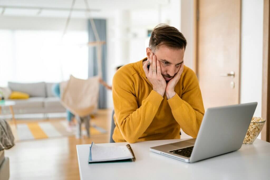 context switching cost for amazon sellers - Overwhelmed seller with face in hands at a laptop